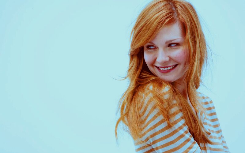 woman with red hair smiling