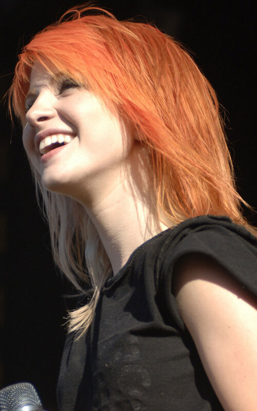 woman with red hair smiling