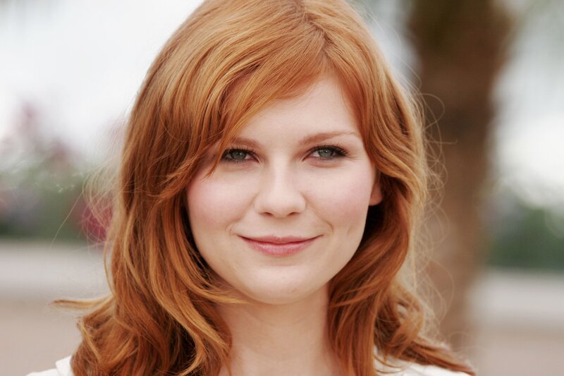 woman with red hair smiling