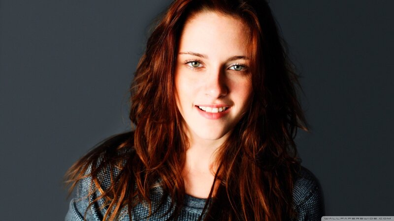 woman with red hair smiling