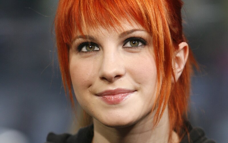 woman with red hair smiling