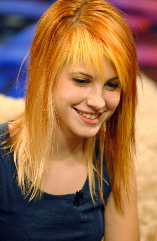 woman with red hair smiling
