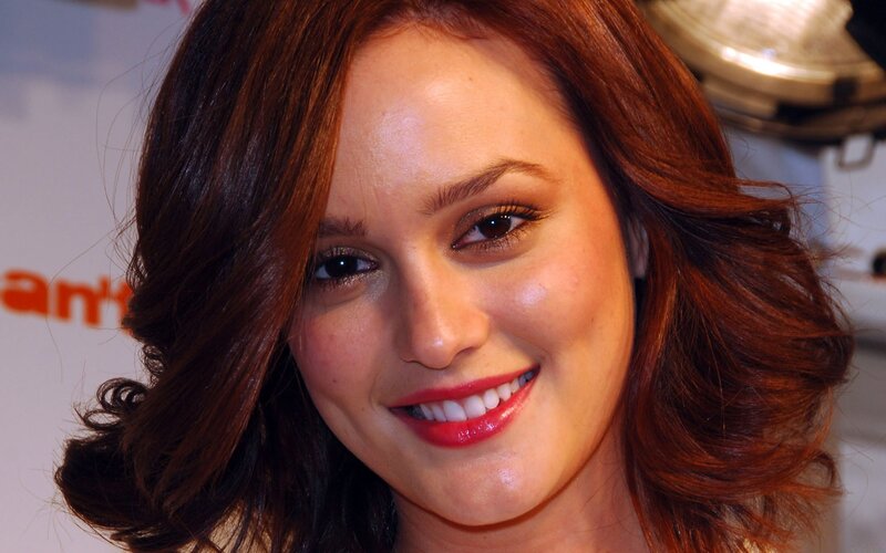 woman with red hair smiling