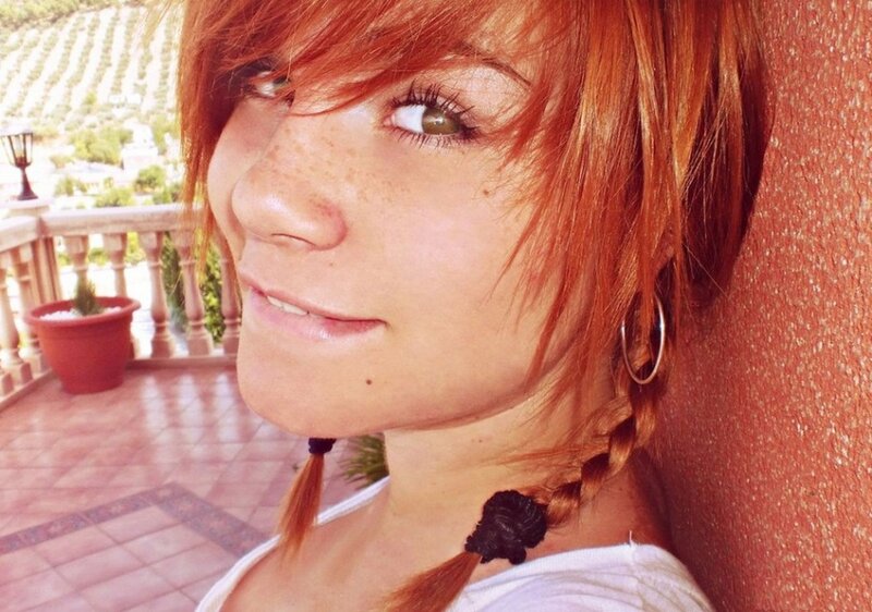 woman with red hair smiling