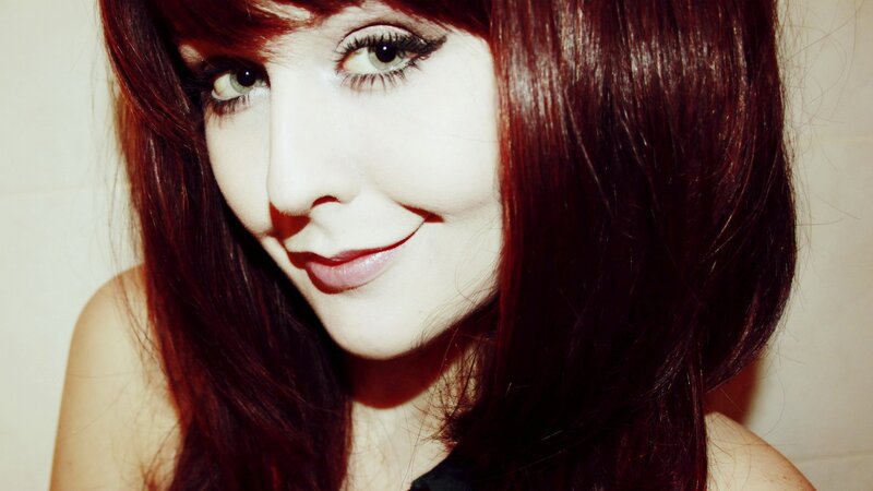 woman with red hair smiling