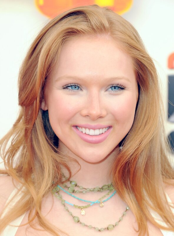woman with red hair smiling
