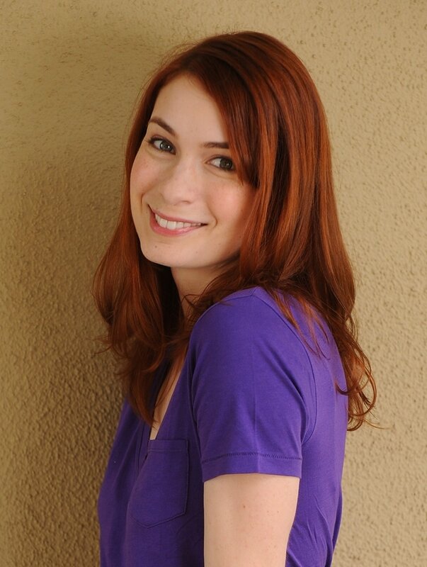 woman with red hair smiling