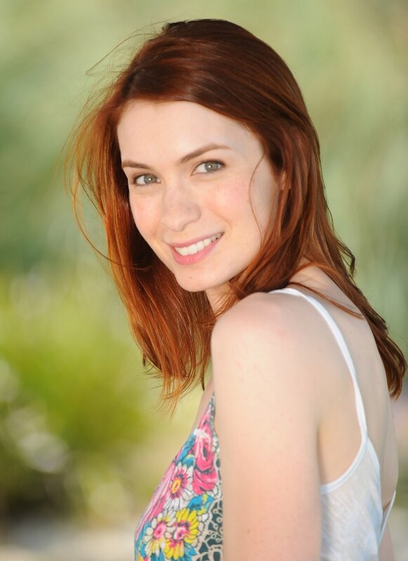 woman with red hair smiling