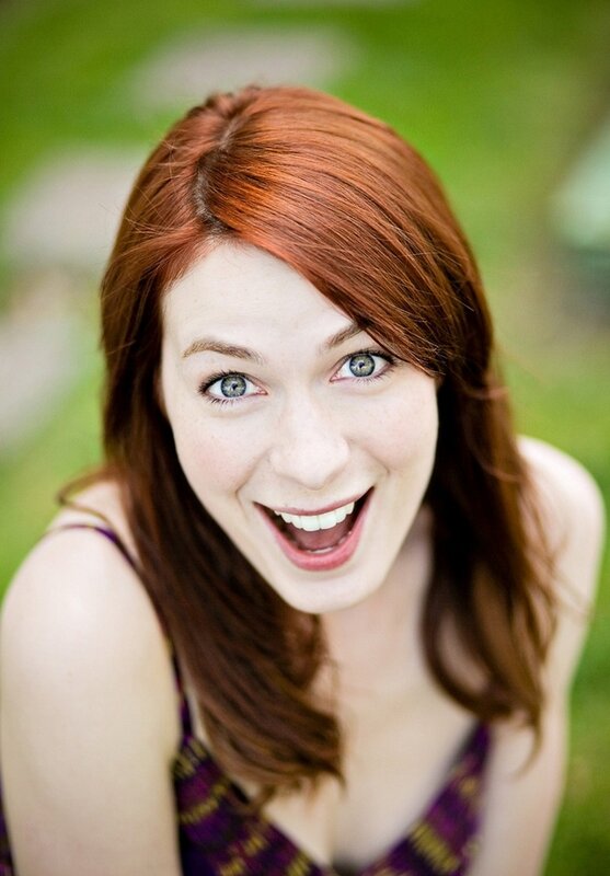 woman with red hair smiling