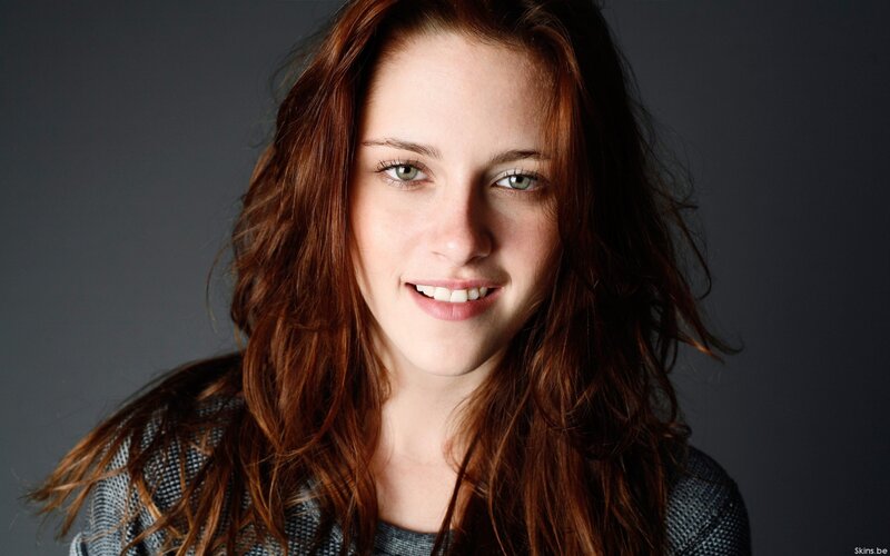 woman with red hair smiling