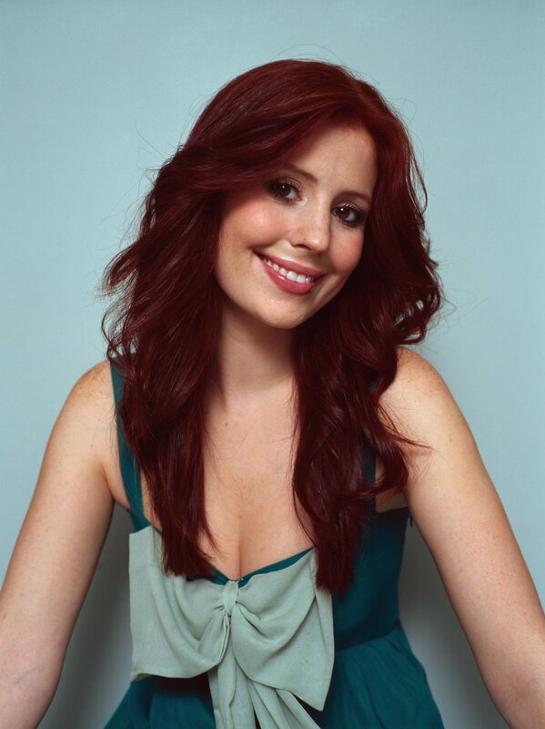 woman with red hair smiling