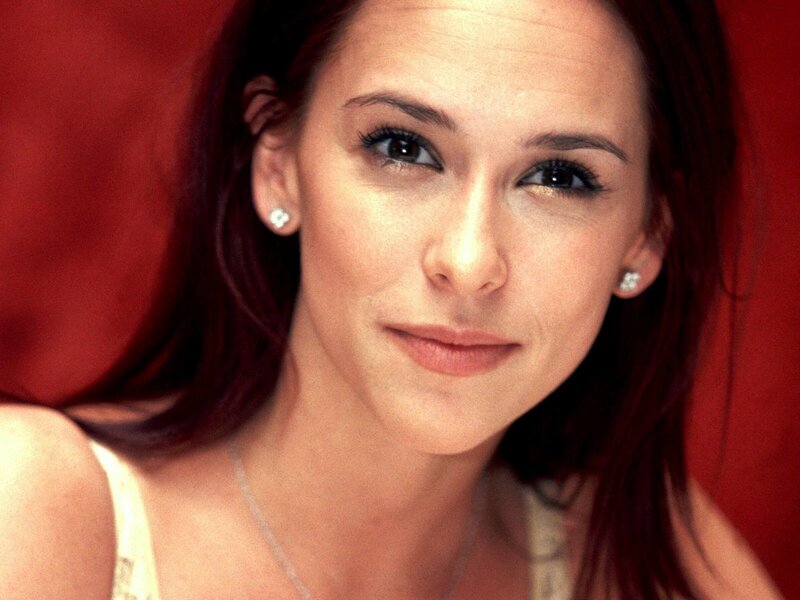 woman with red hair smiling