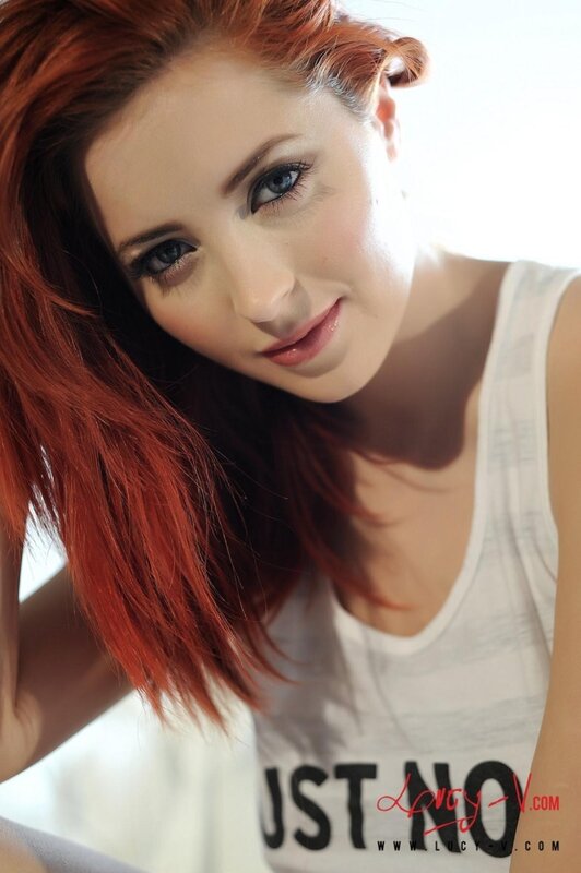 woman with red hair smiling