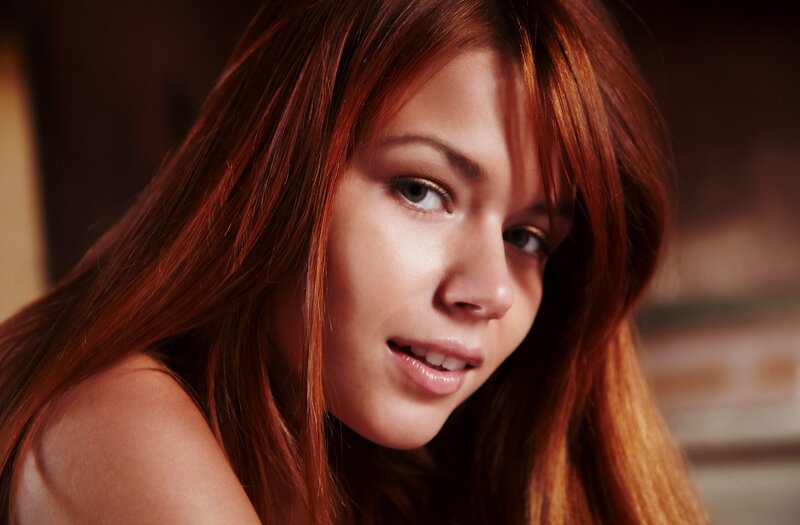 woman with red hair smiling