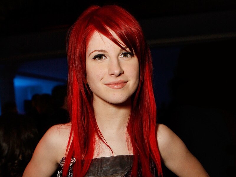 woman with red hair smiling