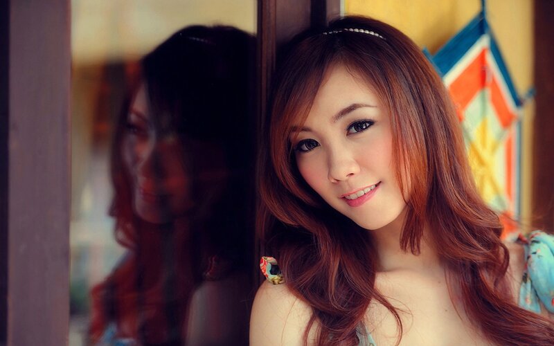 woman with red hair smiling