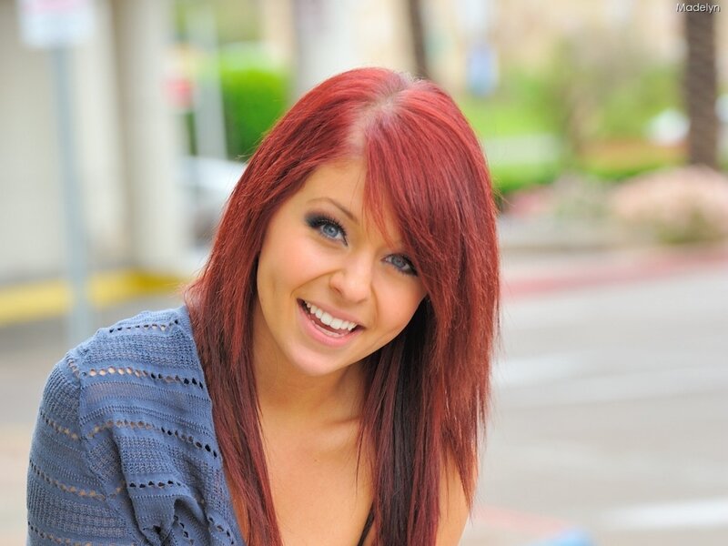 woman with red hair smiling