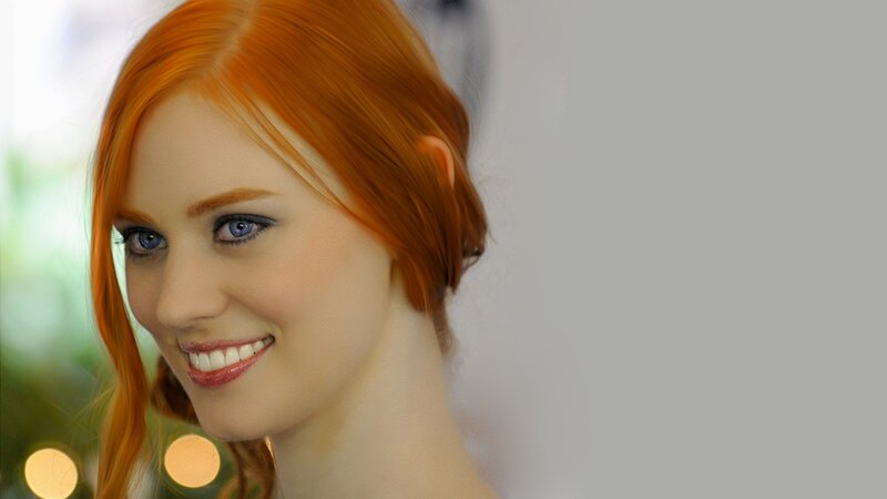woman with red hair smiling
