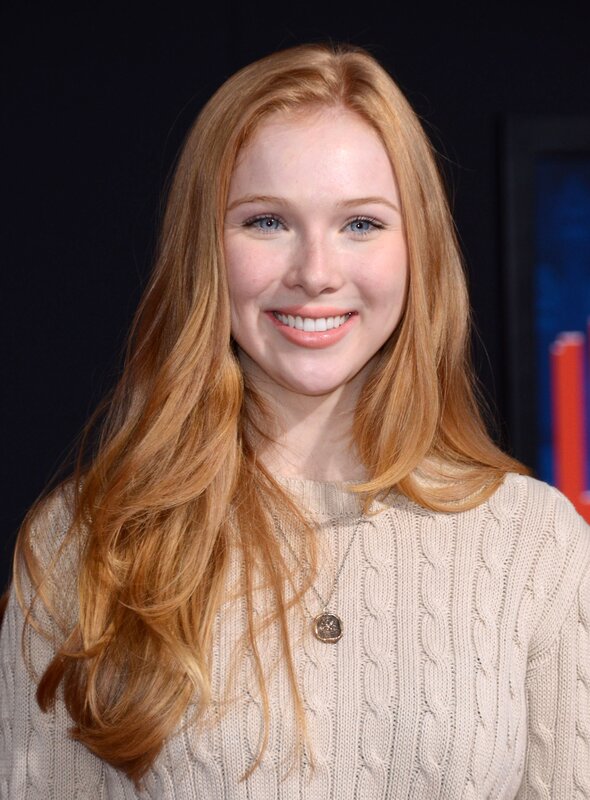 woman with red hair smiling
