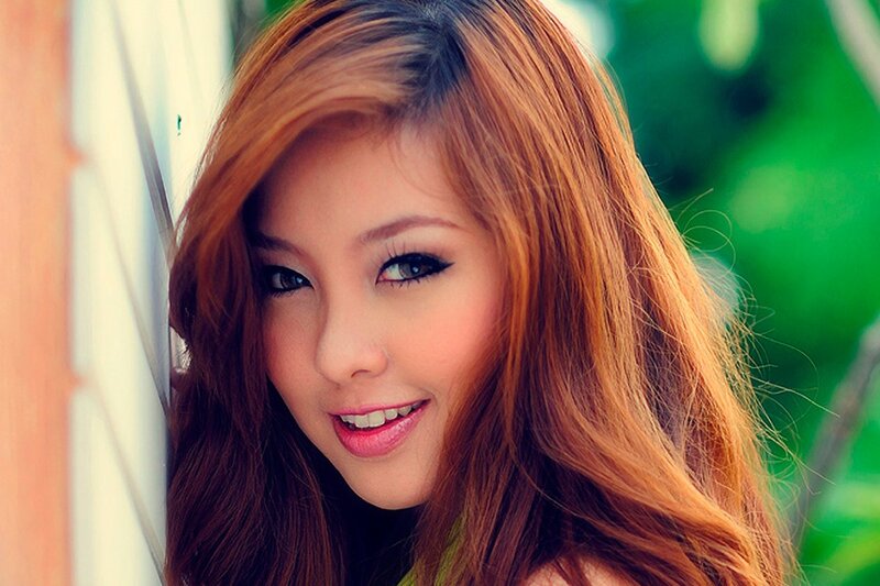 woman with red hair smiling