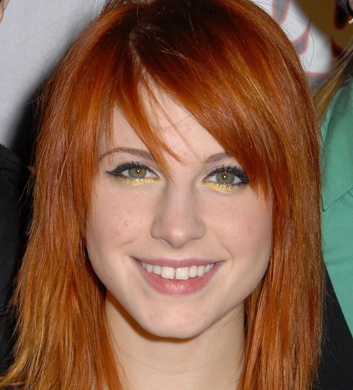 woman with red hair smiling