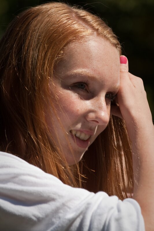 woman with red hair smiling
