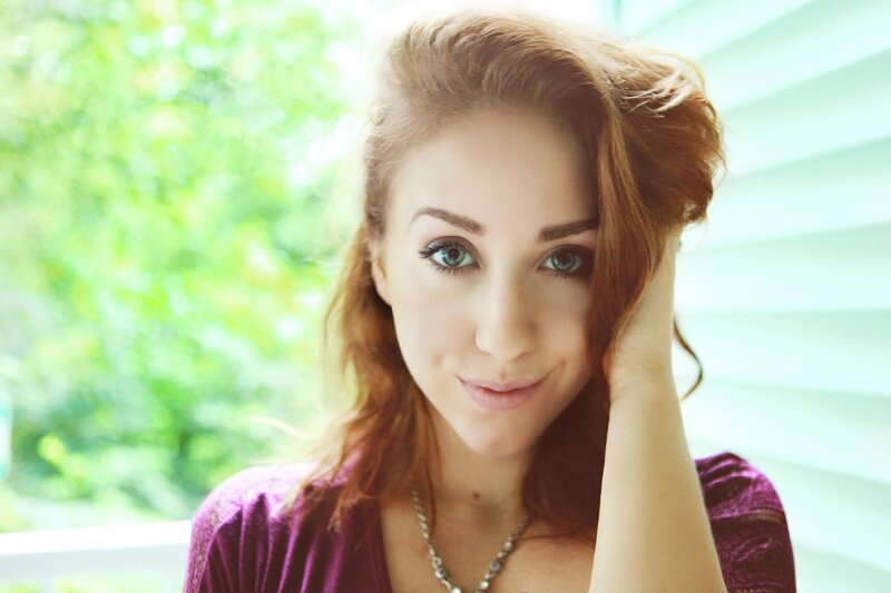 woman with red hair smiling