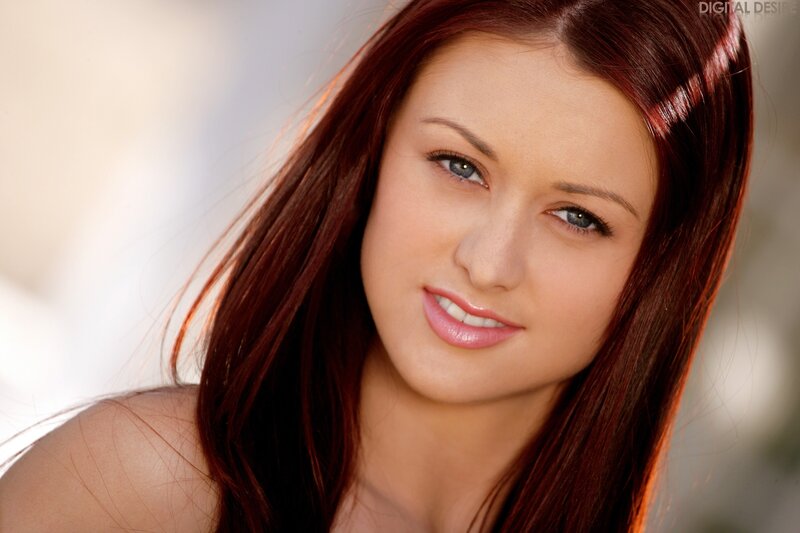 woman with red hair smiling