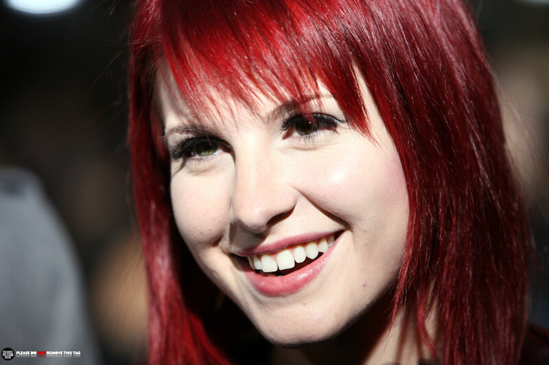 woman with red hair smiling