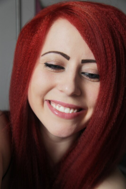 woman with red hair smiling