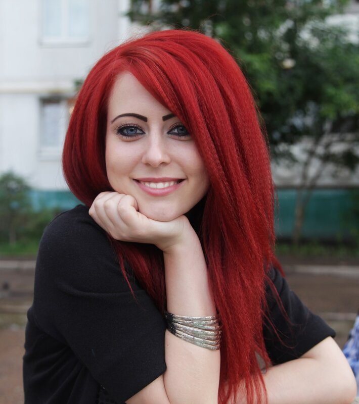 woman with red hair smiling