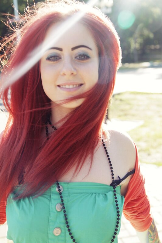 woman with red hair smiling