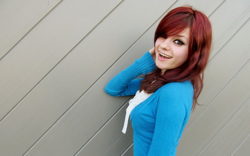 woman with red hair smiling