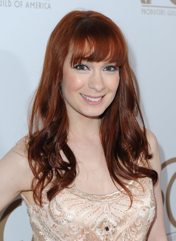 woman with red hair smiling