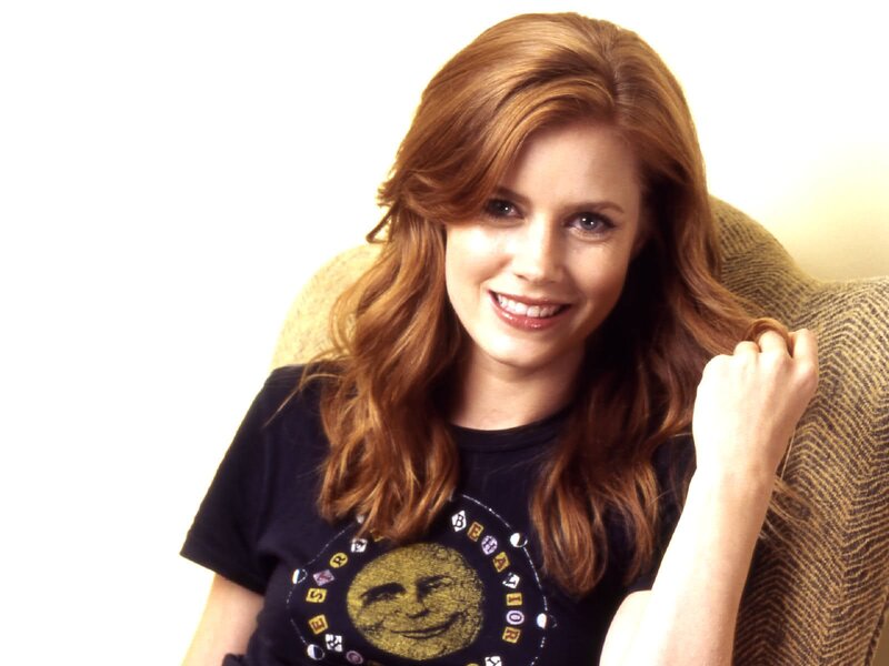 woman with red hair smiling