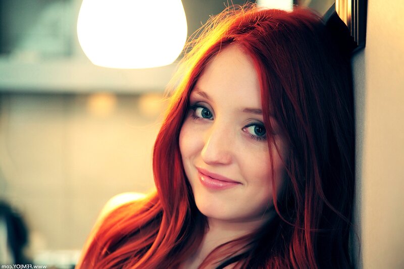 woman with red hair smiling