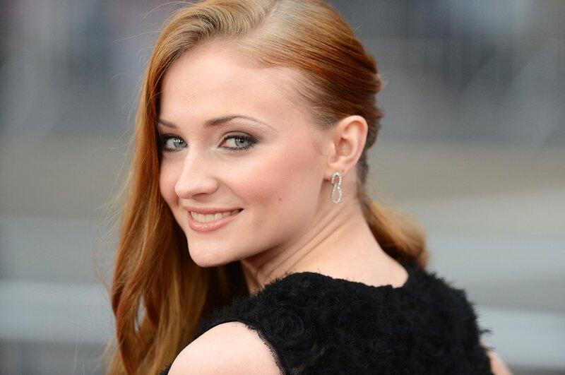 woman with red hair smiling