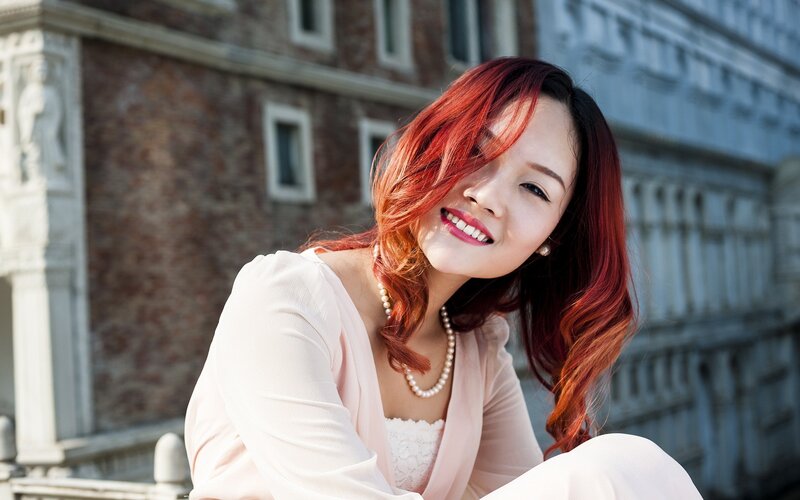 woman with red hair smiling