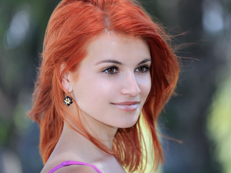 woman with red hair smiling