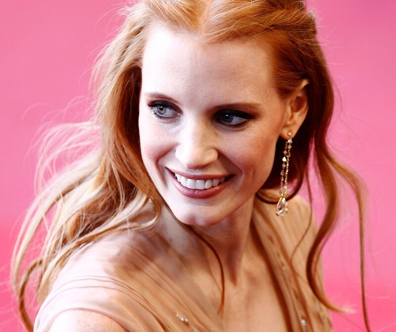 woman with red hair smiling