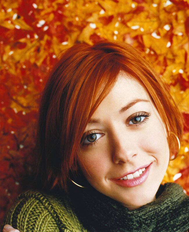 woman with red hair smiling