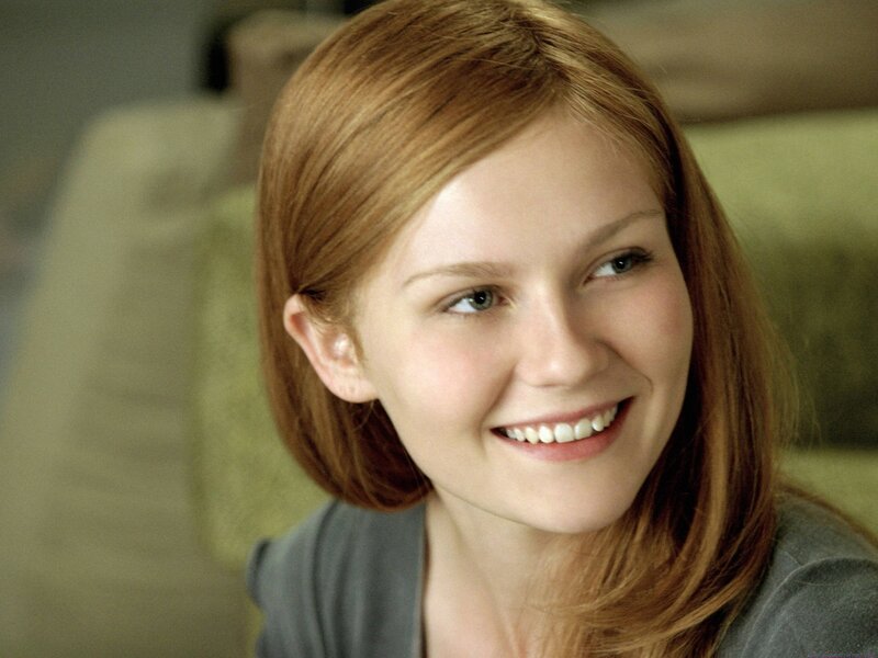 woman with red hair smiling