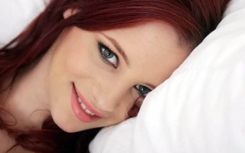 woman with red hair smiling