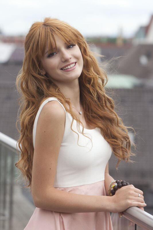 woman with red hair smiling