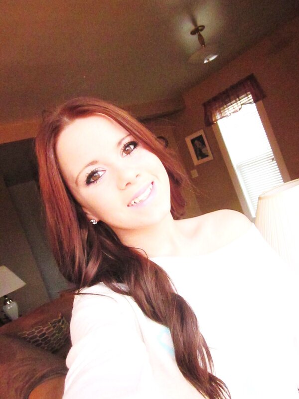 woman with red hair smiling