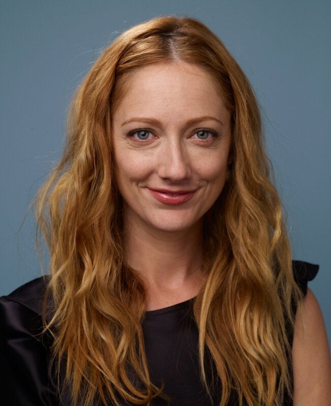 woman with red hair smiling