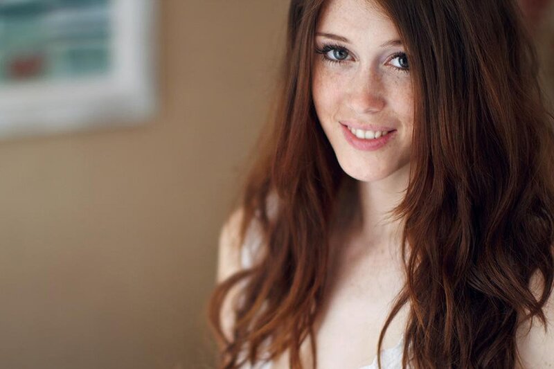 woman with red hair smiling