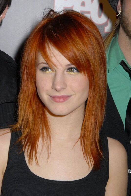 woman with red hair smiling