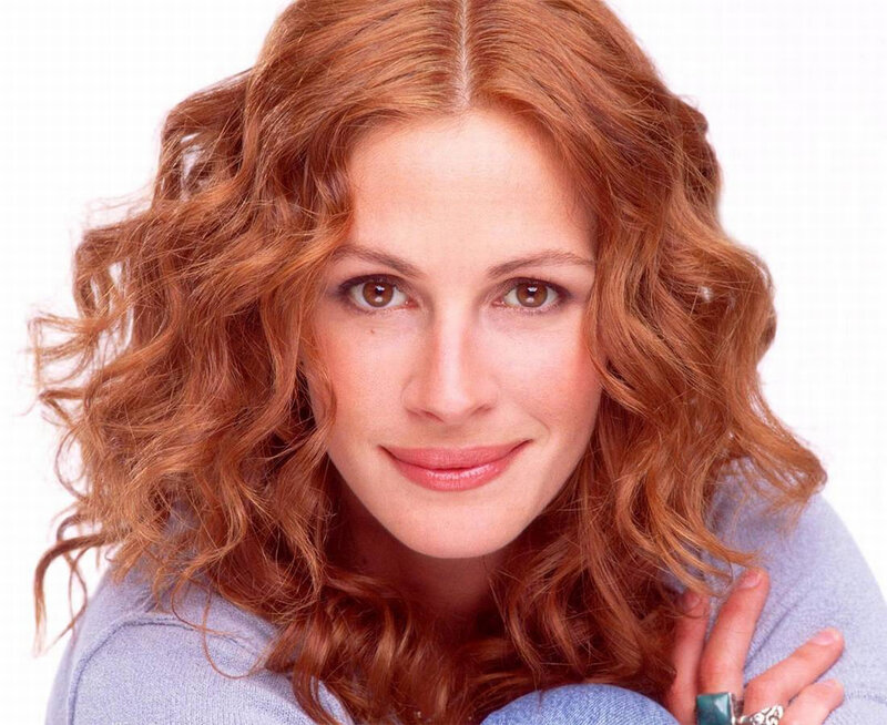 woman with red hair smiling