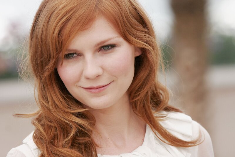 woman with red hair smiling
